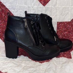 Black woman’s boots with heel.
